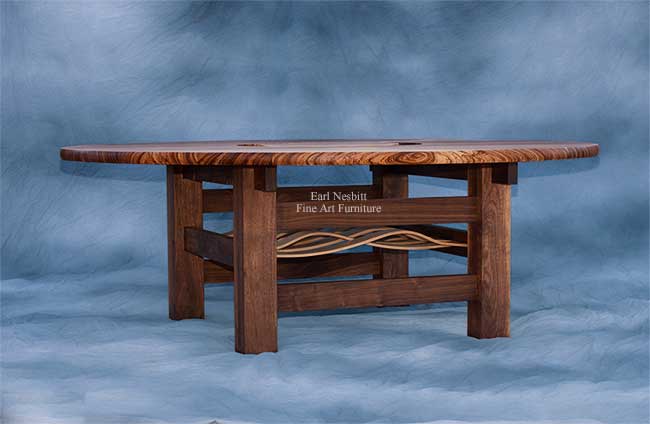 custom made round dining table showing walnut base with curly maple bent laminate slats